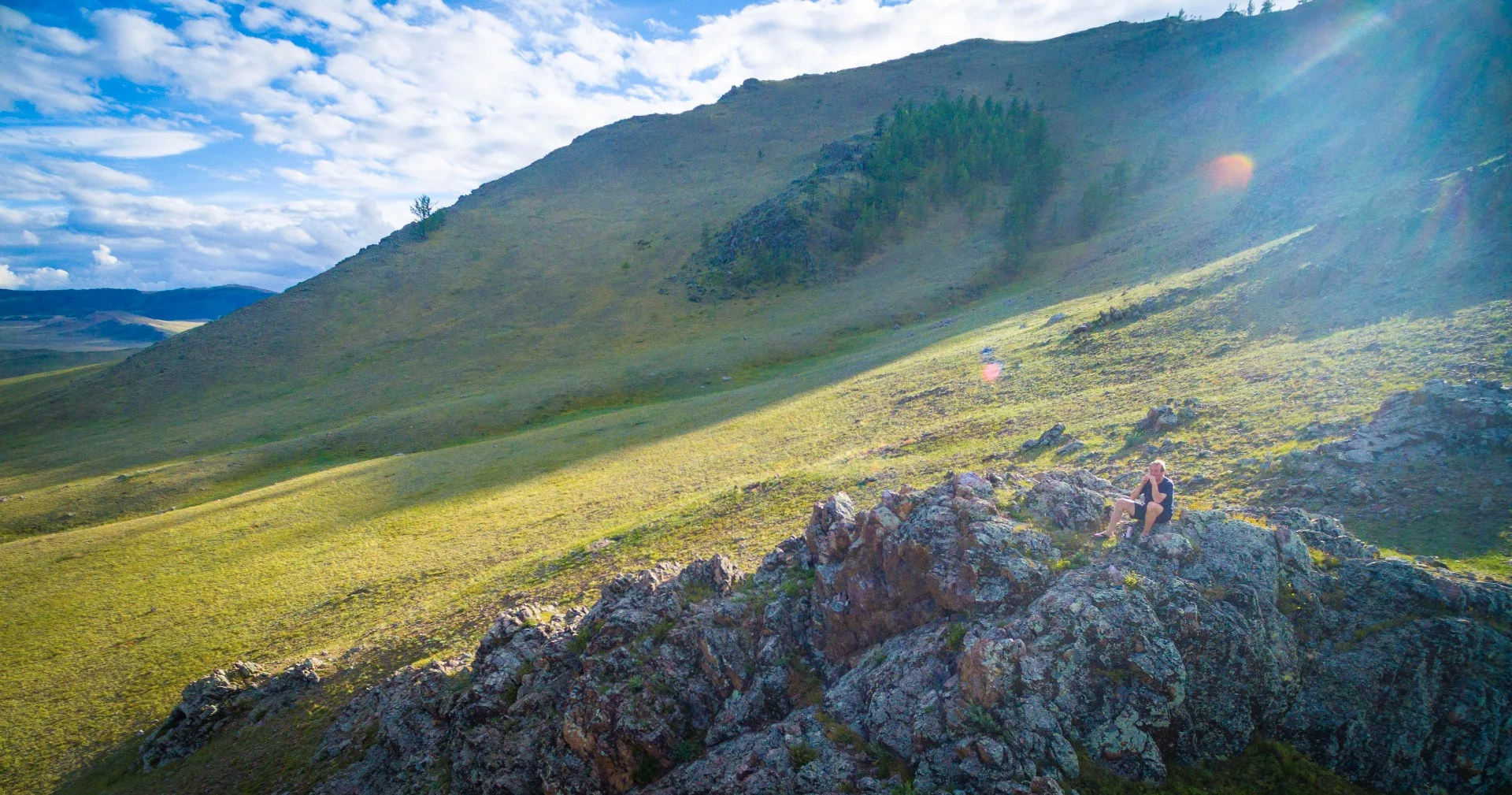 Chris "Bandy" Auld finds a nice place to play some harmonica.