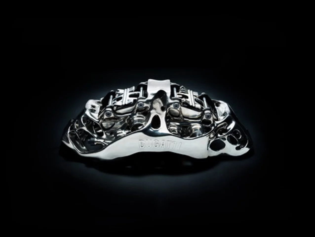 This brake caliper is the largest functional titanium automotive component produced by 3-D printing in the world
