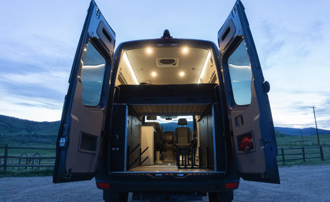 The base package brings the bed, power and lighting, and the Skier/Surfer pack adds the gear racks, water heater and more