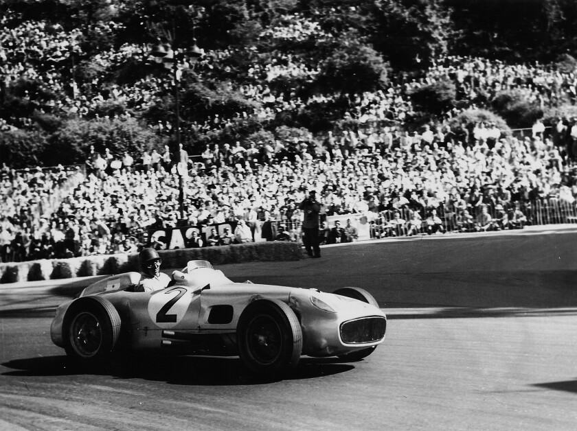 Fangio in the world record auction car, on the way to winning the 1954 German Grand Prix at Nürburgring