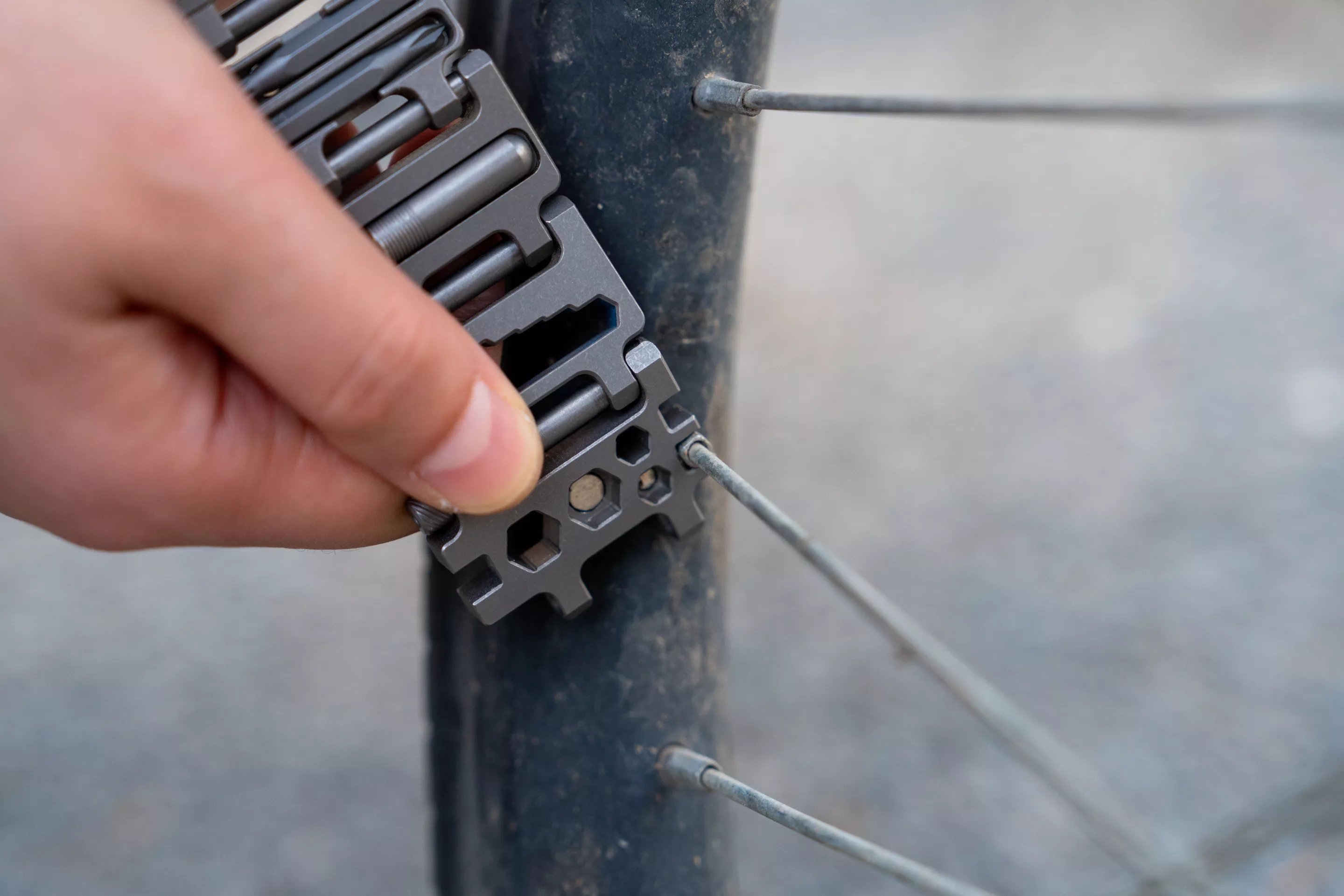 A spoke wrench is just one of the many tools that could get you out of trouble when on the move
