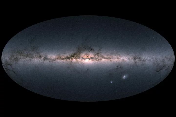 Gaia's all-sky view of the Milky Way and neighboring galaxies – bright regions towards the middle indicate the star-dense galactic center, while the darker wisps indicate interstellar dust. The two bright blobs on the lower right are the Large and Small Magellanic Clouds, two dwarf galaxies that orbit the Milky Way