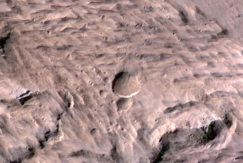 Impact craters such as the one pictured above have the capacity to excavate rocks that would ordinarily be inaccessible to Mars exploration missions