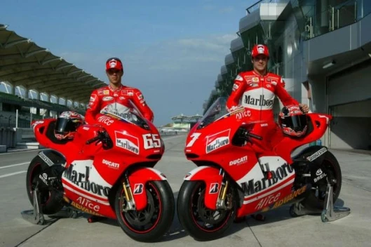 Loris Capirossi and Carlos Checa in pre-season testing prior to Checa's injury