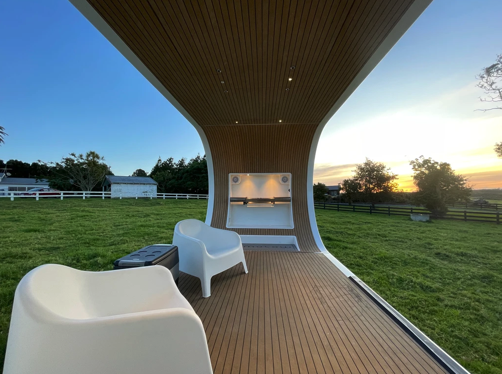 The arched deck wall can be equipped with a fold-down table, as pictured, or a fold-down bench seat