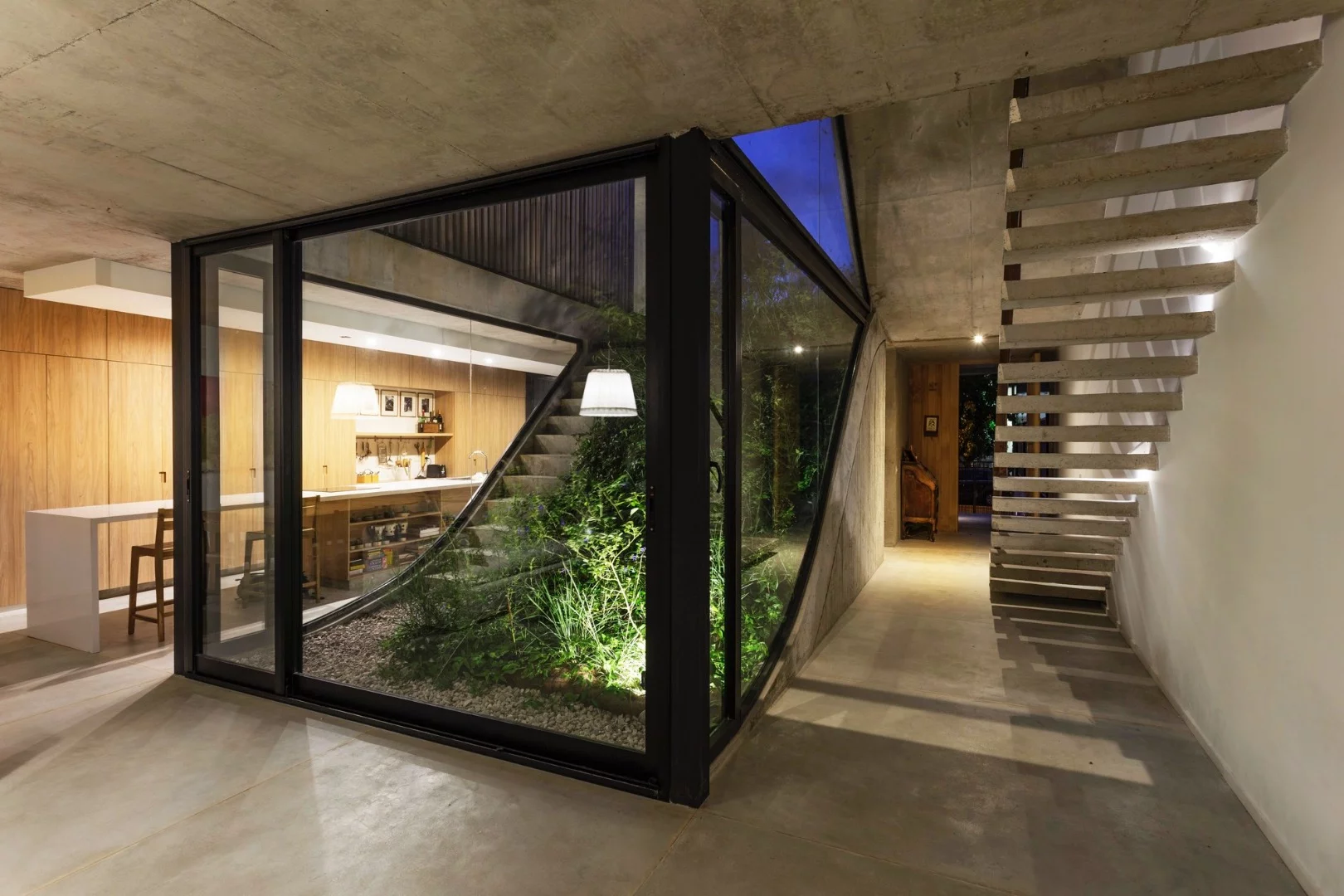 MeMo House opens up to the outside with multiple sliding doors and windows and their layout has been carefully calculated to promote cross-ventilation, minimizing air-conditioner needs