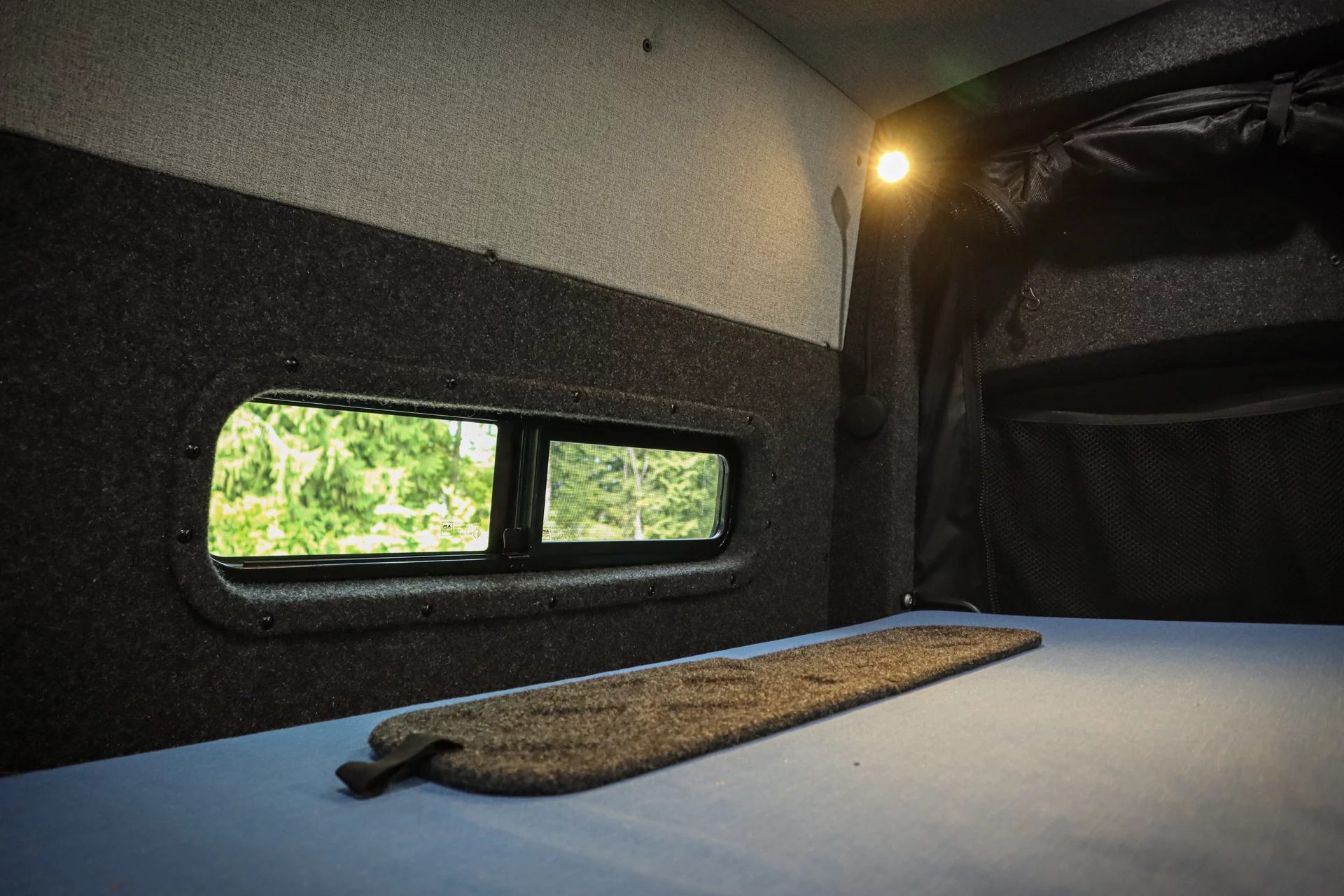 The window black-out shades can fold in half for screen access