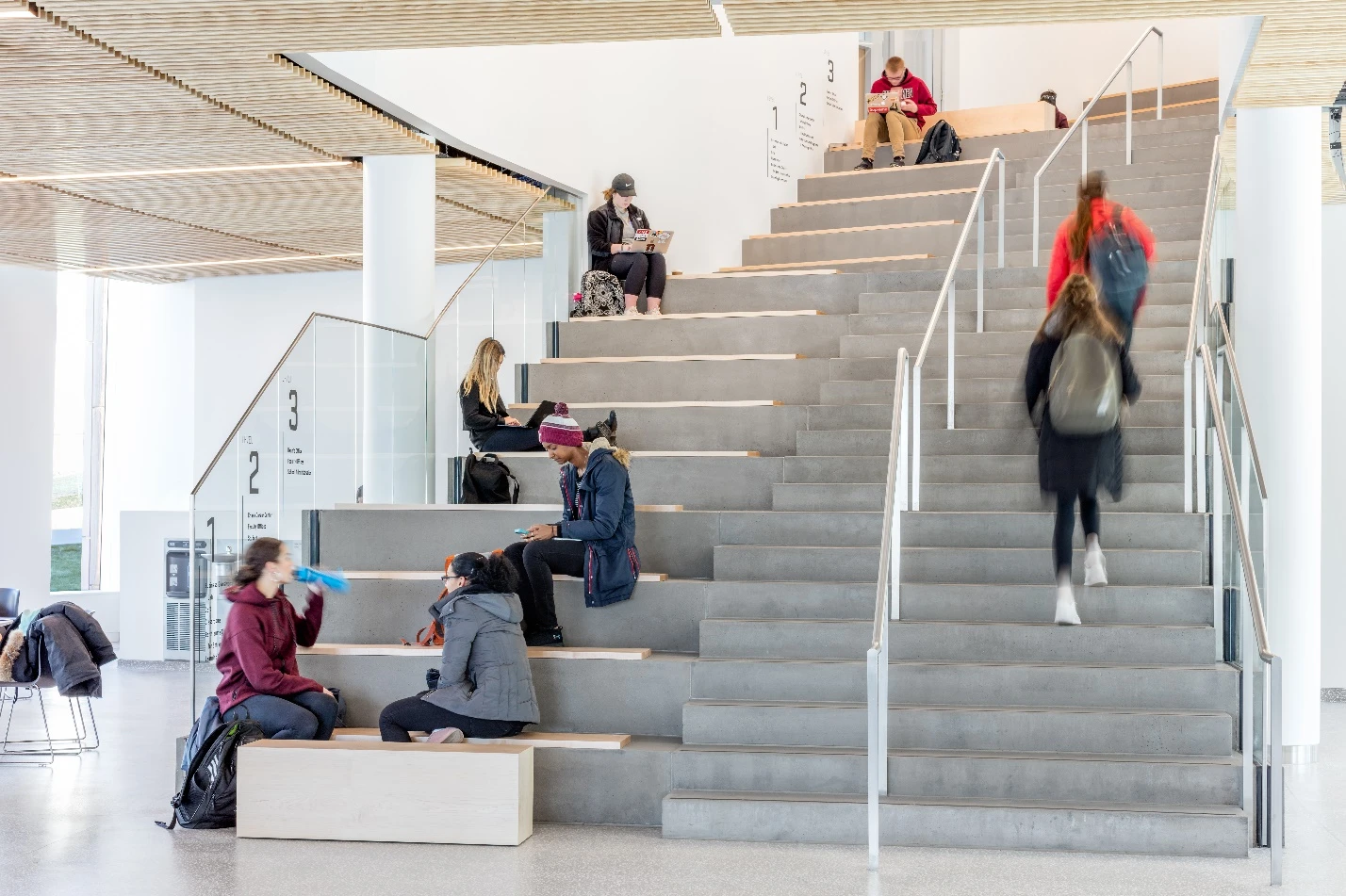 Visitors enter the Business Innovation Hub into a multi-story atrium, which includes dining and seating facilities