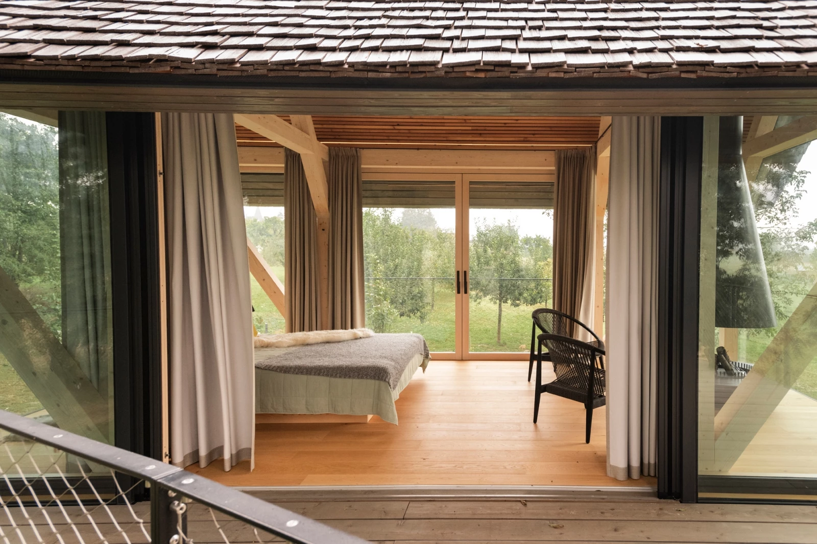 Sliding glass doors open the home to the adjoining outdoor terrace