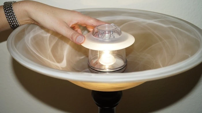 A light bulb with the sunlight from the Light Bandit