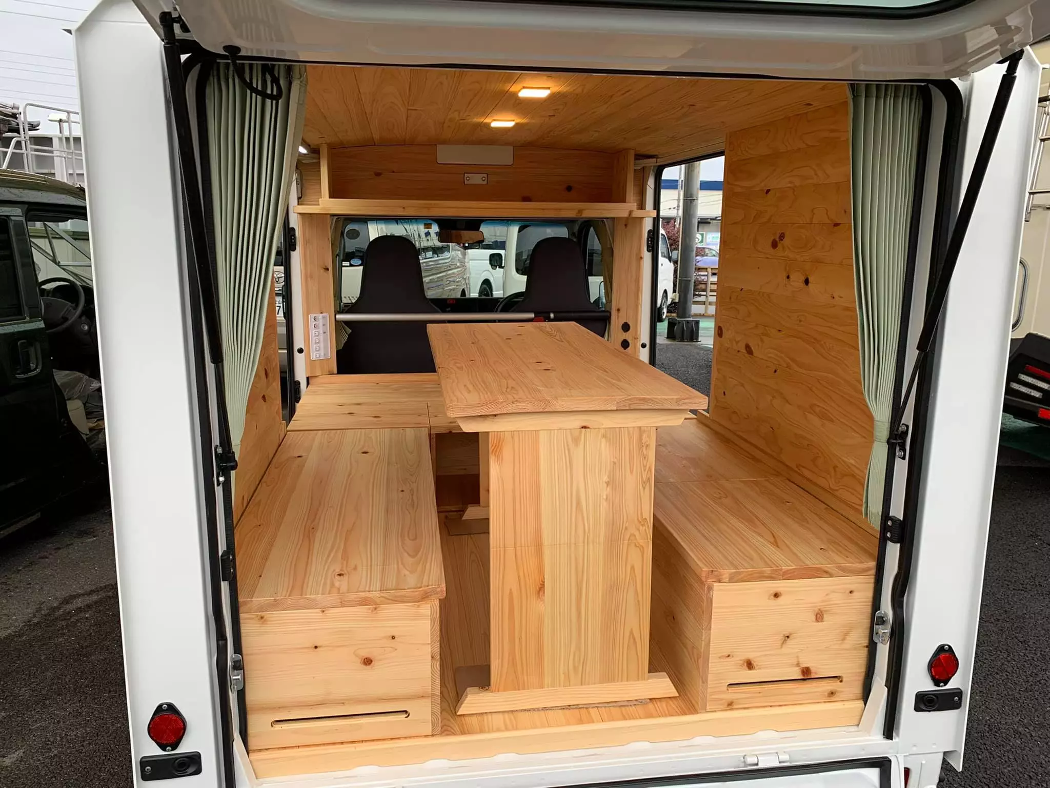 Mishima Quokka micro-camper set up for dining and relaxing