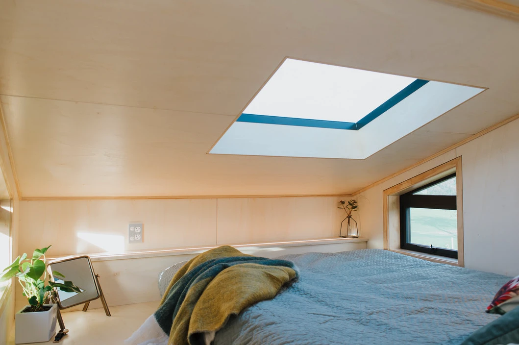 The First Light Tiny House's bedroom has a queen-sized bed