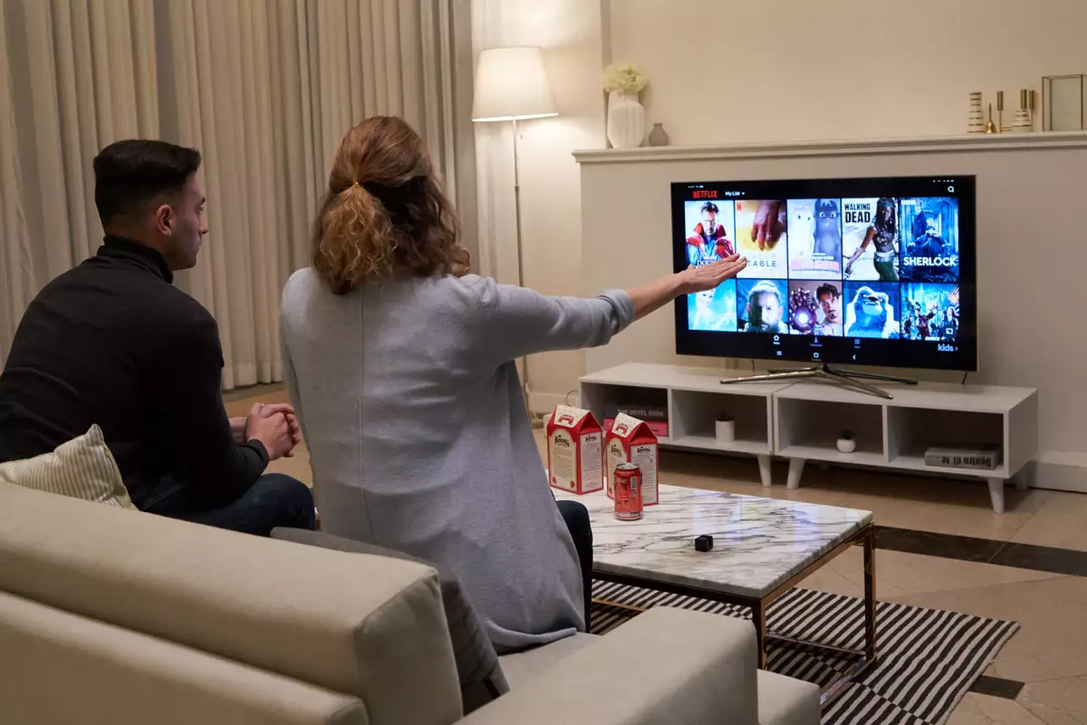 Glamos is a small device that projects a virtual touchscreen in the air, allowing regular TVs to become gesture-controlled