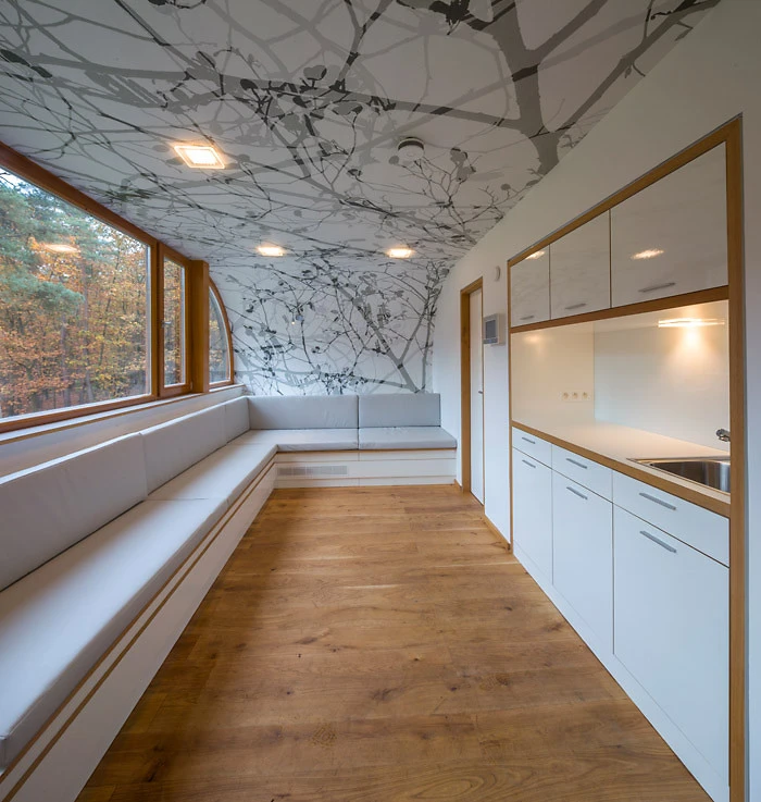 The lower cabin is furnished with a coffee lounge, pantry, restroom and technology room