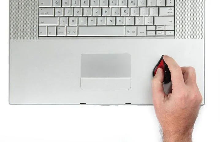 The Swiftmouse offers pen-like comfort and traditional mouse functionality while sitting on top of a laptop's palm rest
