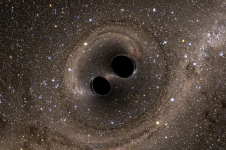 Two black holes colliding far out in space have produced gravity waves that have been detected by super-sensitive equipment on Earth for the very first time