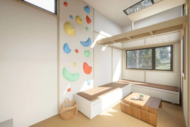 The Funhouse's living room features a climbing wall that offers access to its upper netted area