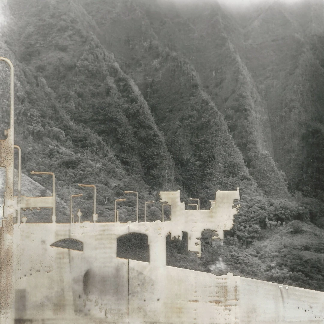 In the artist's words: "This series takes place in my home of Hawaii. I use traditional film and silver gelatin to shoot and print images of controversial building and infrastructure projects in Hawaii. I then attempt to remove the buildings from the image by laser etching them. The laser leaves a scar on the image, much like the permanent damage from infrastructure which cannot be removed"