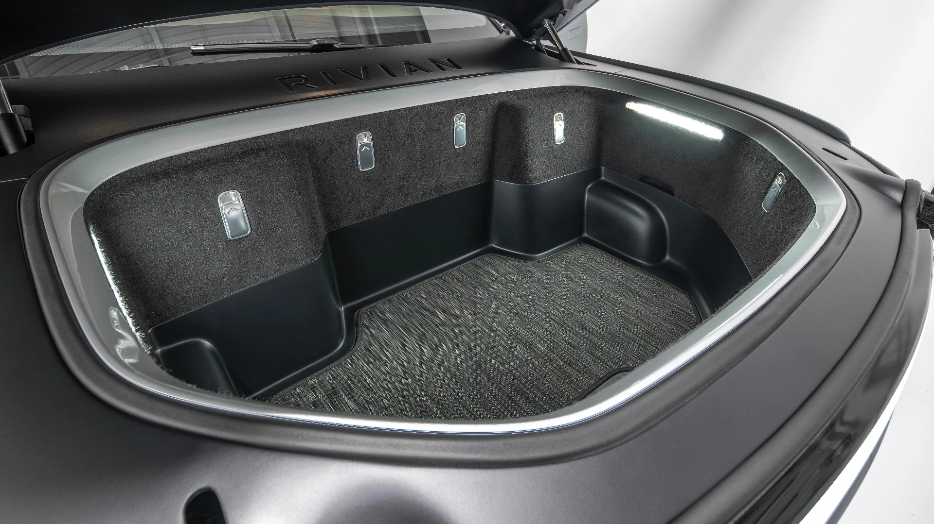 With no engine up front, the R1T has a 330-L front storage trunk