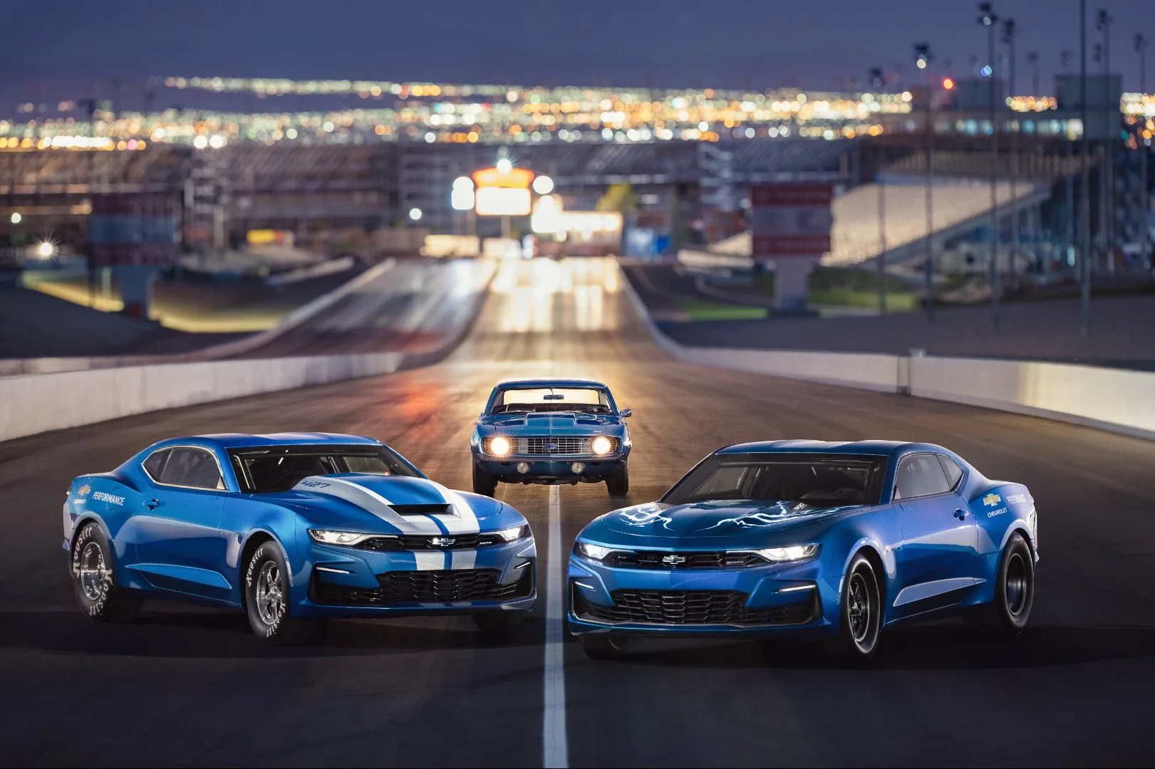 The eCOPO (right) poses with the 2019 COPO Camaro (left) and an original 1969 COPO Camaro (center)