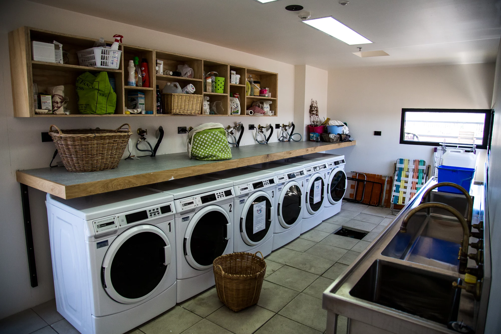 "The Commoners," residents go without personal laundries, using a row of six washing machines and a shared clothesline on the rooftop instead (Photo: Nick Lavars/Gizmag.com)