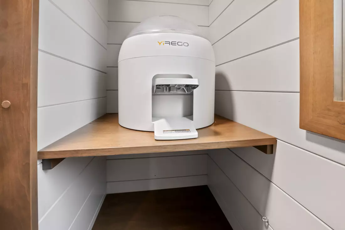 The Pathway's small storage area includes a portable washing machine