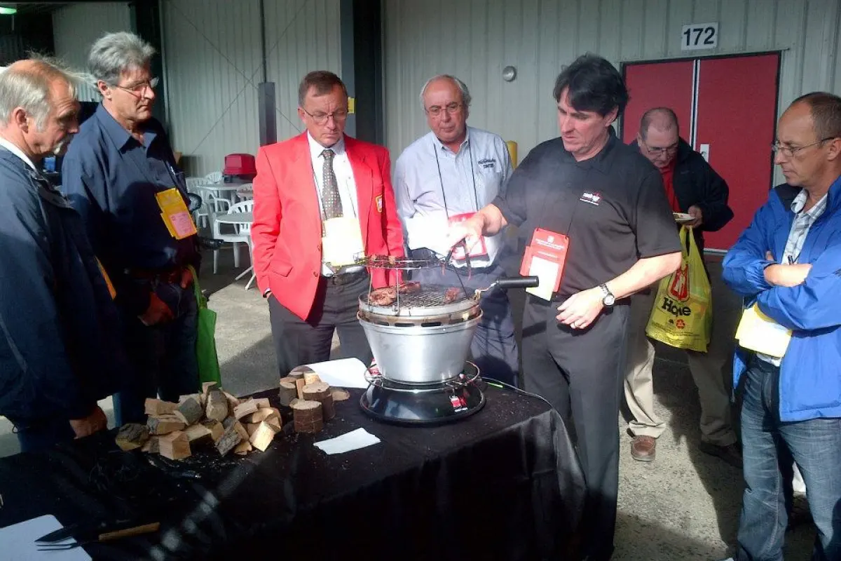 A rep demonstrates the Cook-Air grill