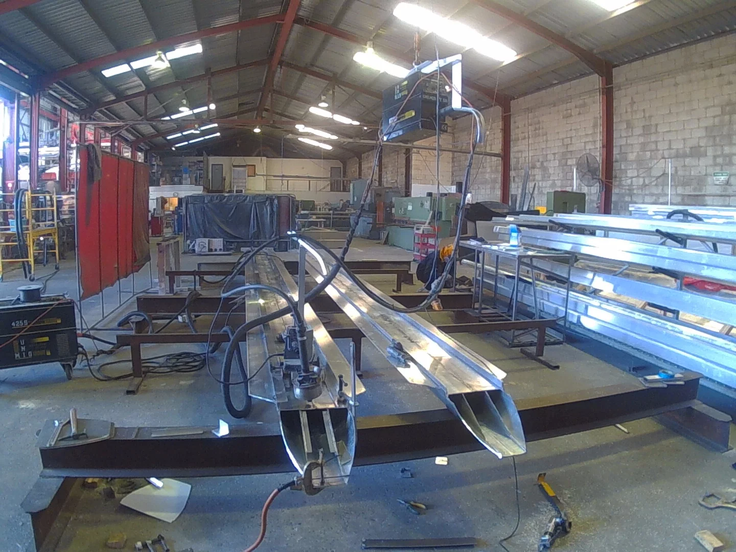 The upside down skis front on preparatory to a robotic welder joining the two extruded halves – the extrusions are made from 6082 (t6) alloy with a minimum wall thickness of 5 mm or greater so they are capable of withstanding a lot of "punishment"