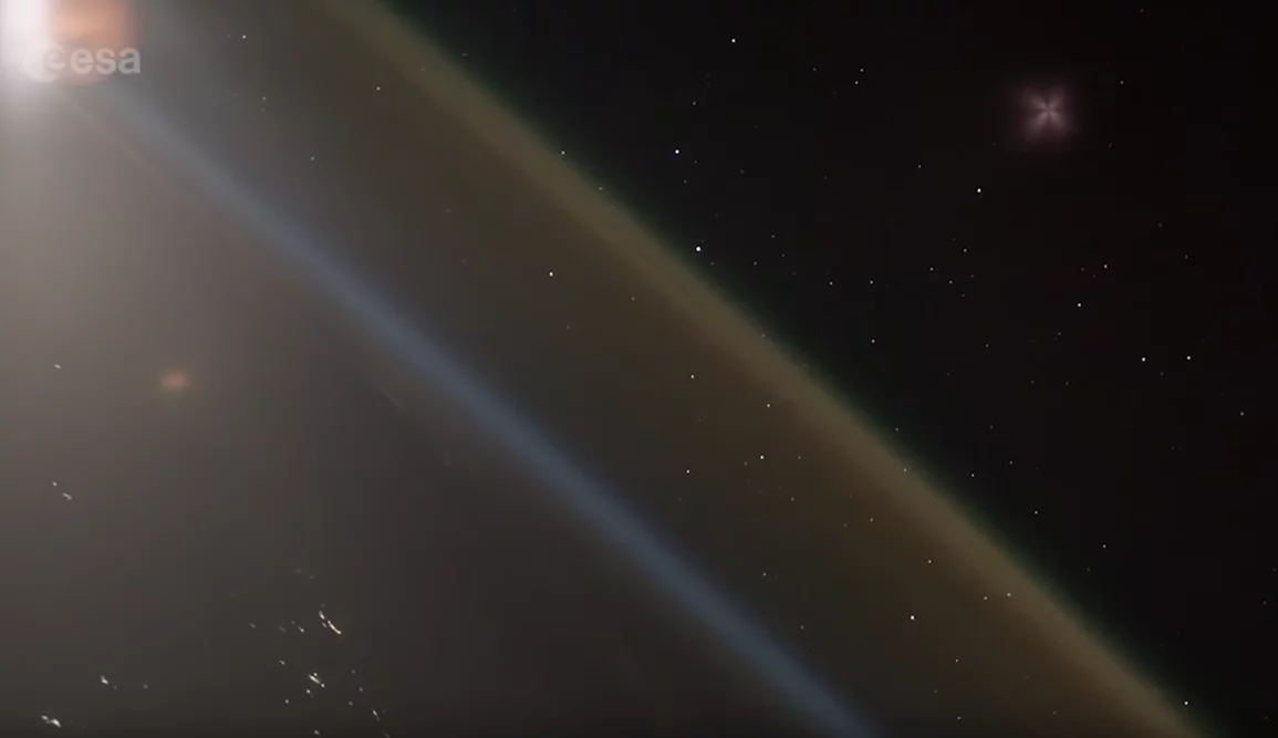 The ascending Soyuz rocket can be seen in the upper right-hand corner