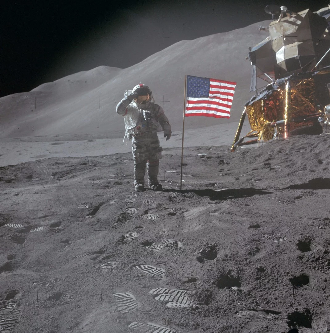 Lunar Module Pilot James Irwin saluting the US flag