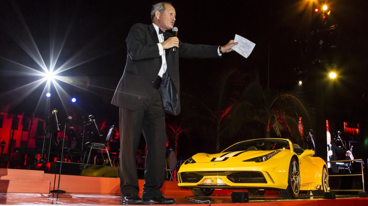 Auctioneer extraordinaire Charlie Ross working the crowd at Beverly Hills City Hall during Ferrari's 60th anniversary of doing business in the United States celebrations on October 12, 2014. Ross auctioned the first of 499 examples of the Ferrari 458 Speciale Aperta. The car wore VIN #001 and fetched $900,000 to the benefit of Daybreak.