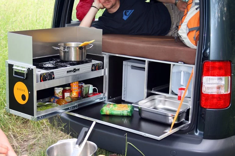 With a few folds and slides the QUQUQ becomes a kitchen and bed