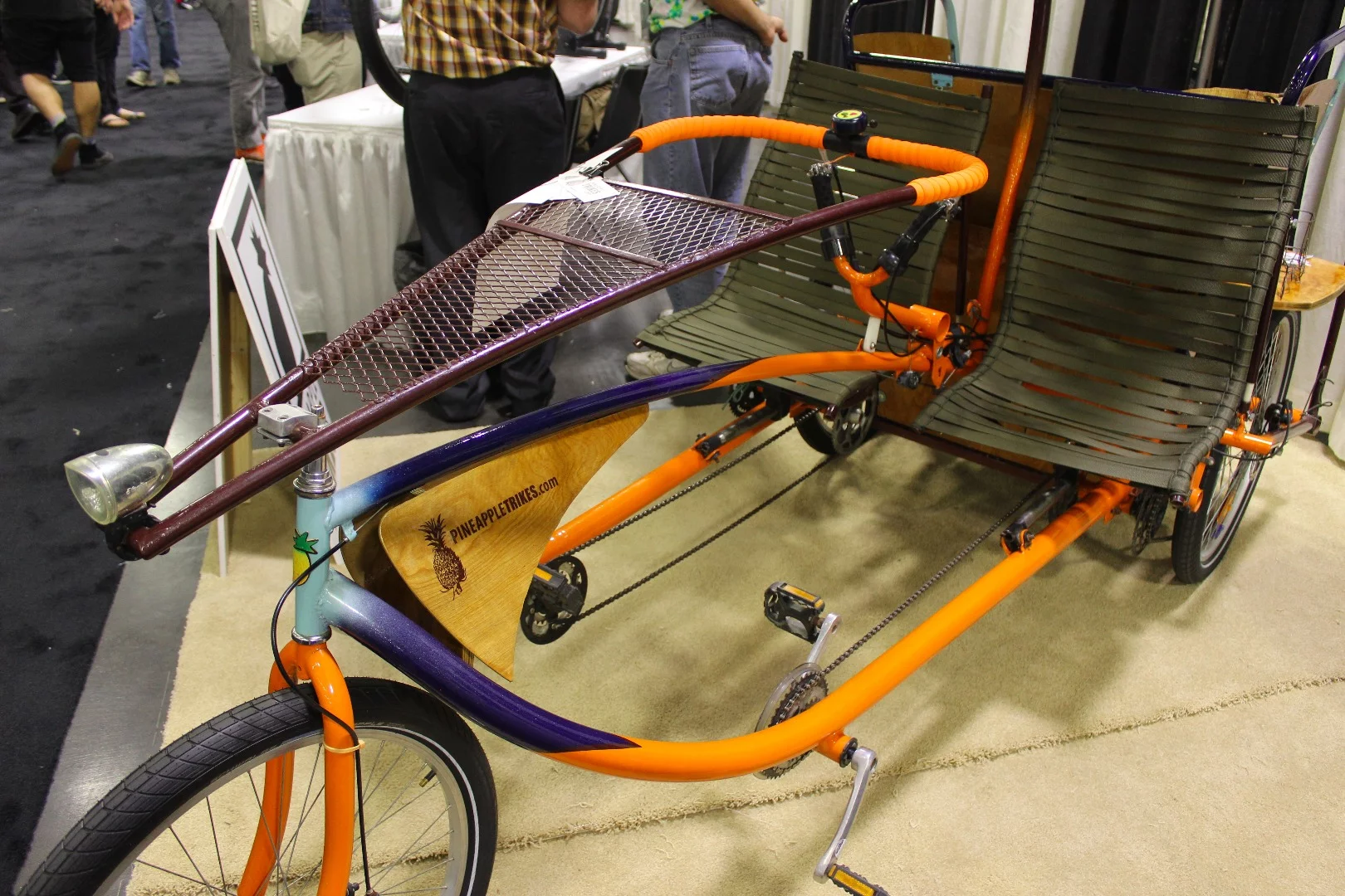 Side-by-side riders share steering and pedalling duty, on this Pineapple Trike