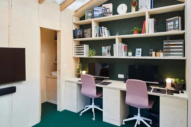 Currently the Light Shed is set up as Andrews' office, featuring two work stations