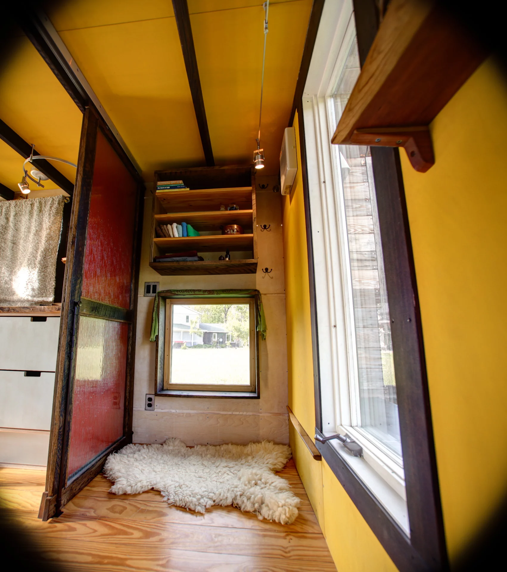 Pocket Shelter features a sliding glass pass-through door and a bathroom with a mini built-in composting toilet