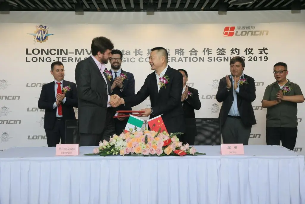 MV Agusta CEO Timur Sardarov (L) and Loncin president Yong Gao (R) shaking on their new agreement to build small-capacity MVs for the Chinese market