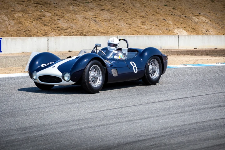 A Maserati Tipo 61 brakes hard for Turn 11 at Laguna Seca during the 2016 Rolex Monterey Motorsports Reunion