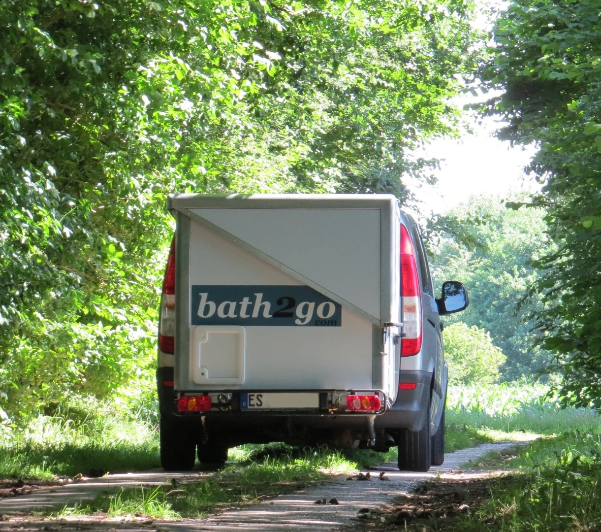 The Bath2Go's triangular pop-up roof folds down to van height for the ride