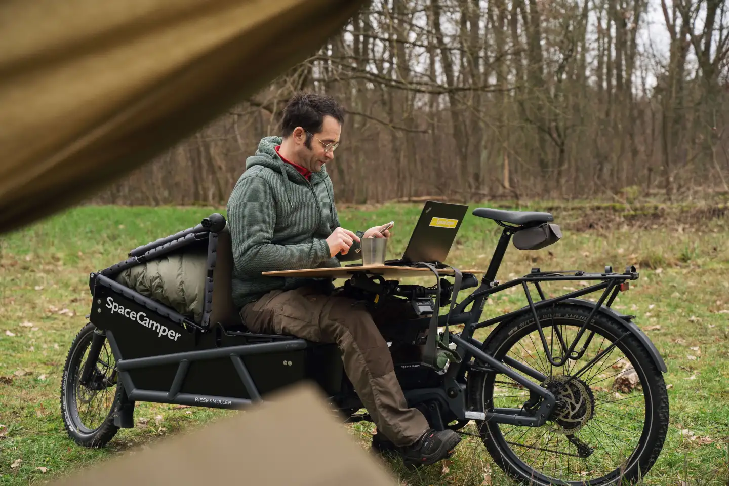 Spacecamper tent-top ebike micro RV pitched at cycling digital nomads