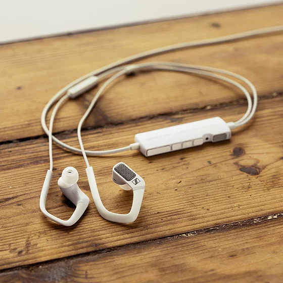 The AMBEO Smart Headset is a pair of in-ear buds with ear hooks that function as a nice iPhone headset, but with a microphone in each ear to enable binaural recording, as well as a few other nifty party tricks