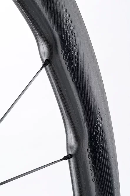 The dimples on the side of the Zipp 454 NSW Carbon Clincher help cut down on buffeting in a crosswind