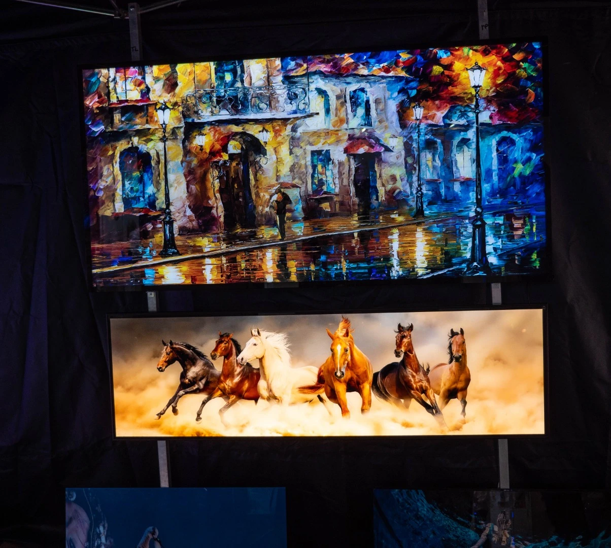 A company called "Lighting Decorative Glass" makes these absolutely stunning back-lit frames. Naturally, they look completely naff in a photograph, but these were the best looking prints in all of Photokina - which is saying something.