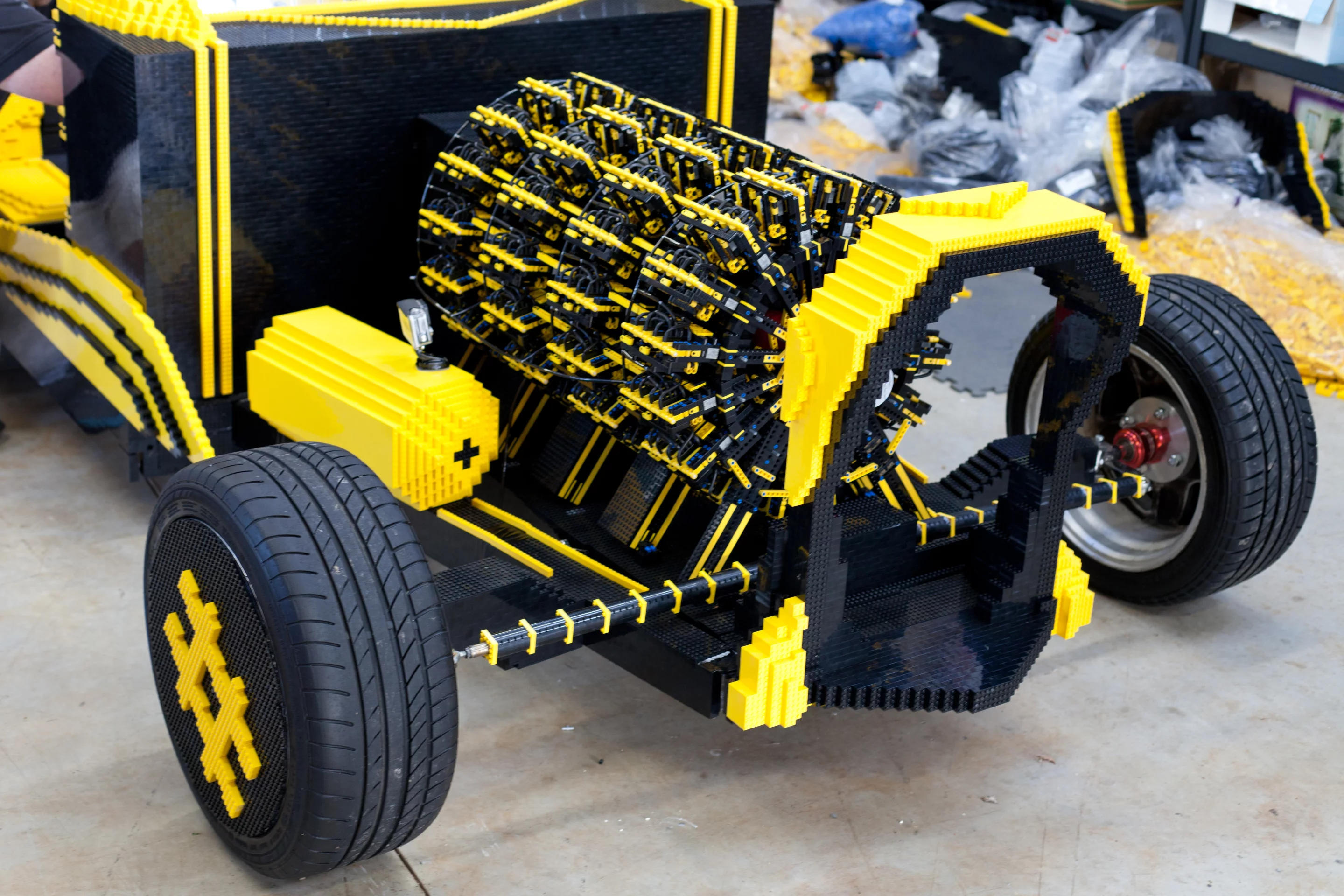 The load bearing components, including tires, wheels and other miscellaneous parts are non-Lego