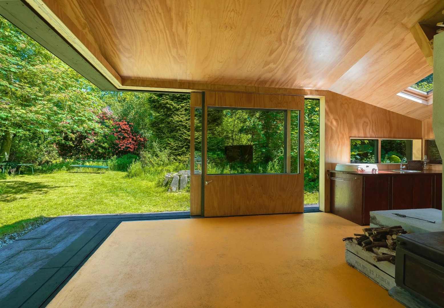 The cabin sports two large sliding doors that open up an entire corner to the outside