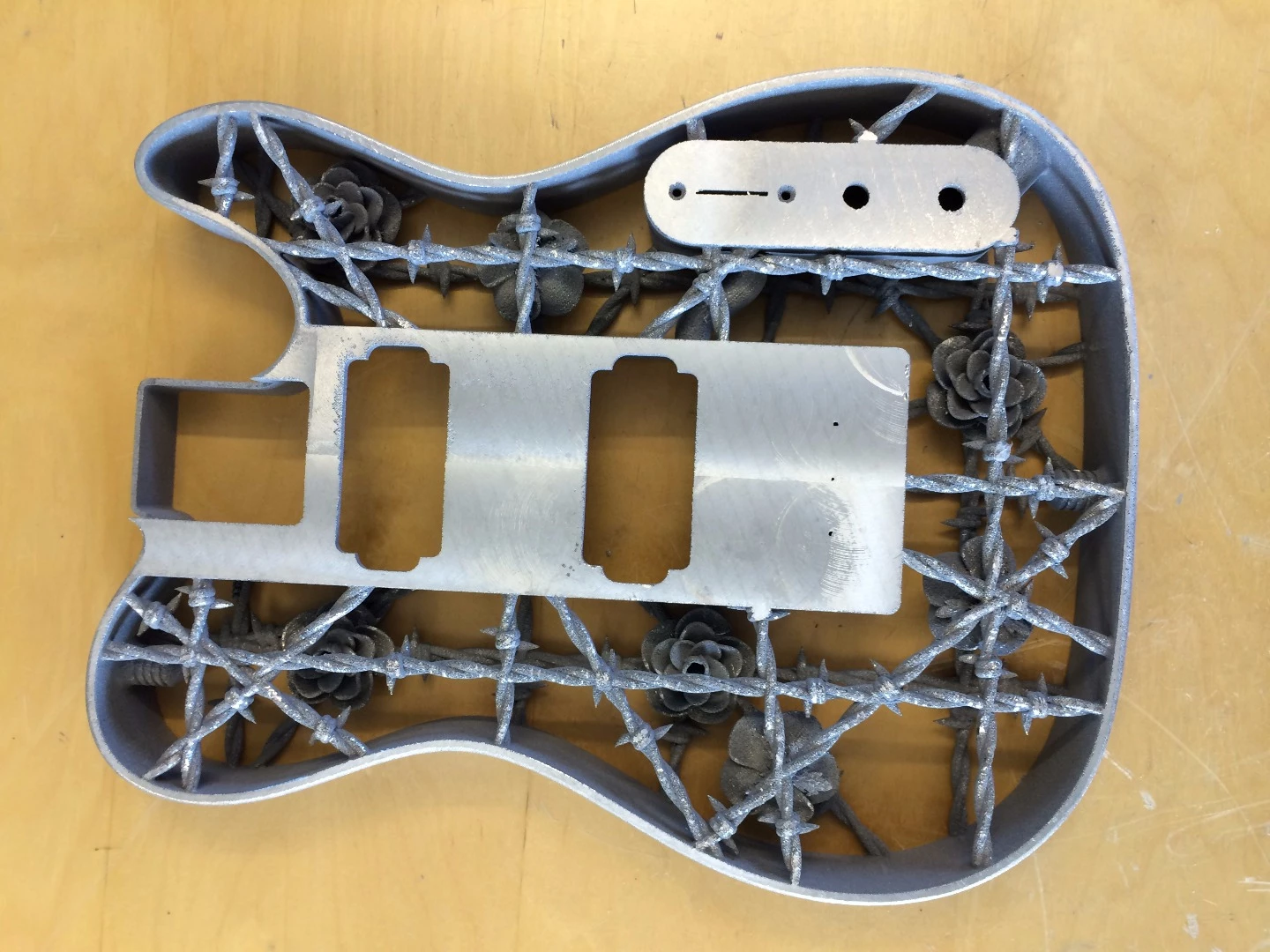 Support material around the pickup area was milled flat, but all other supports were removed by hand