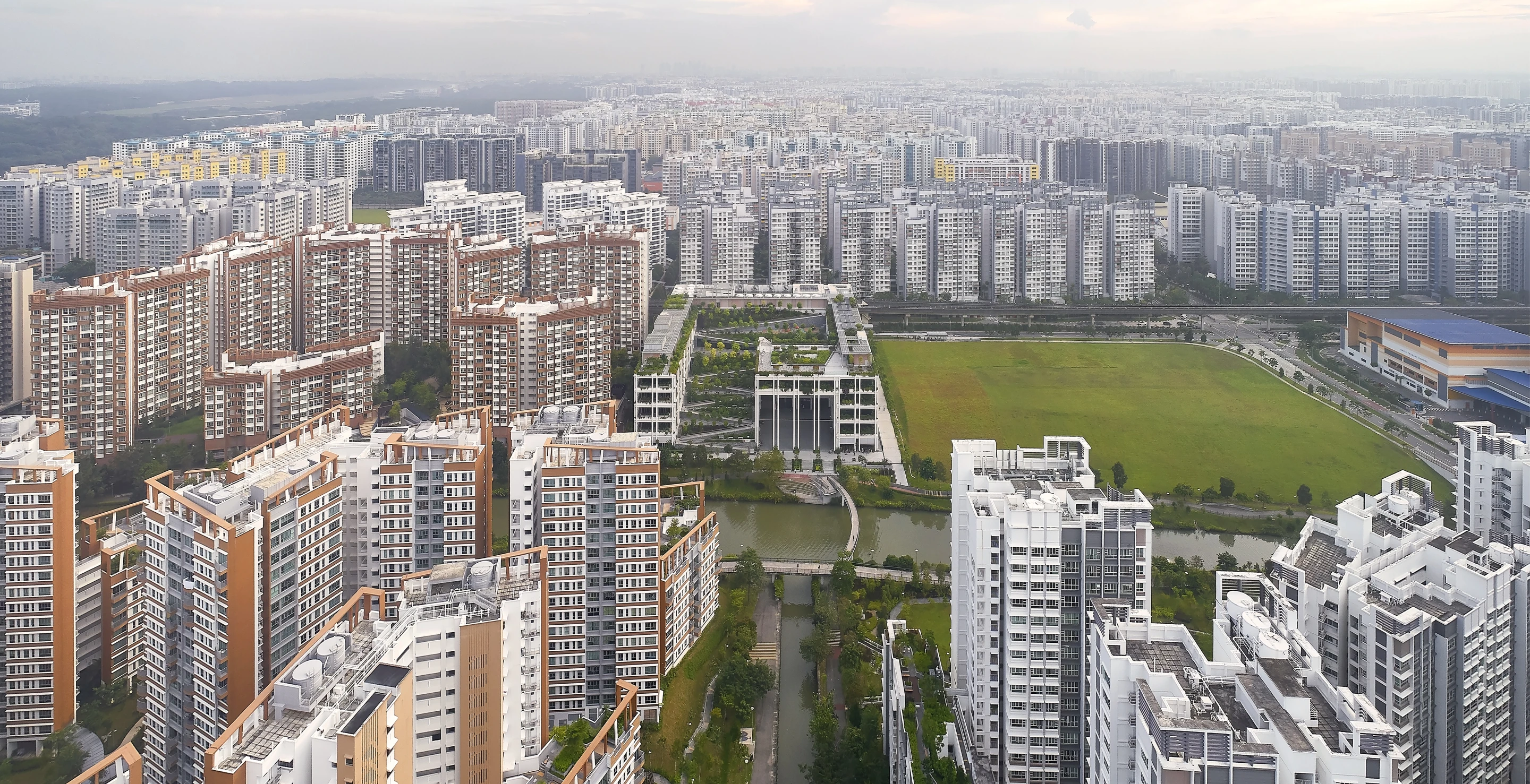 Oasis Terraces takes its place remarkably well among the surrounding buildings in Punggol, Singapore