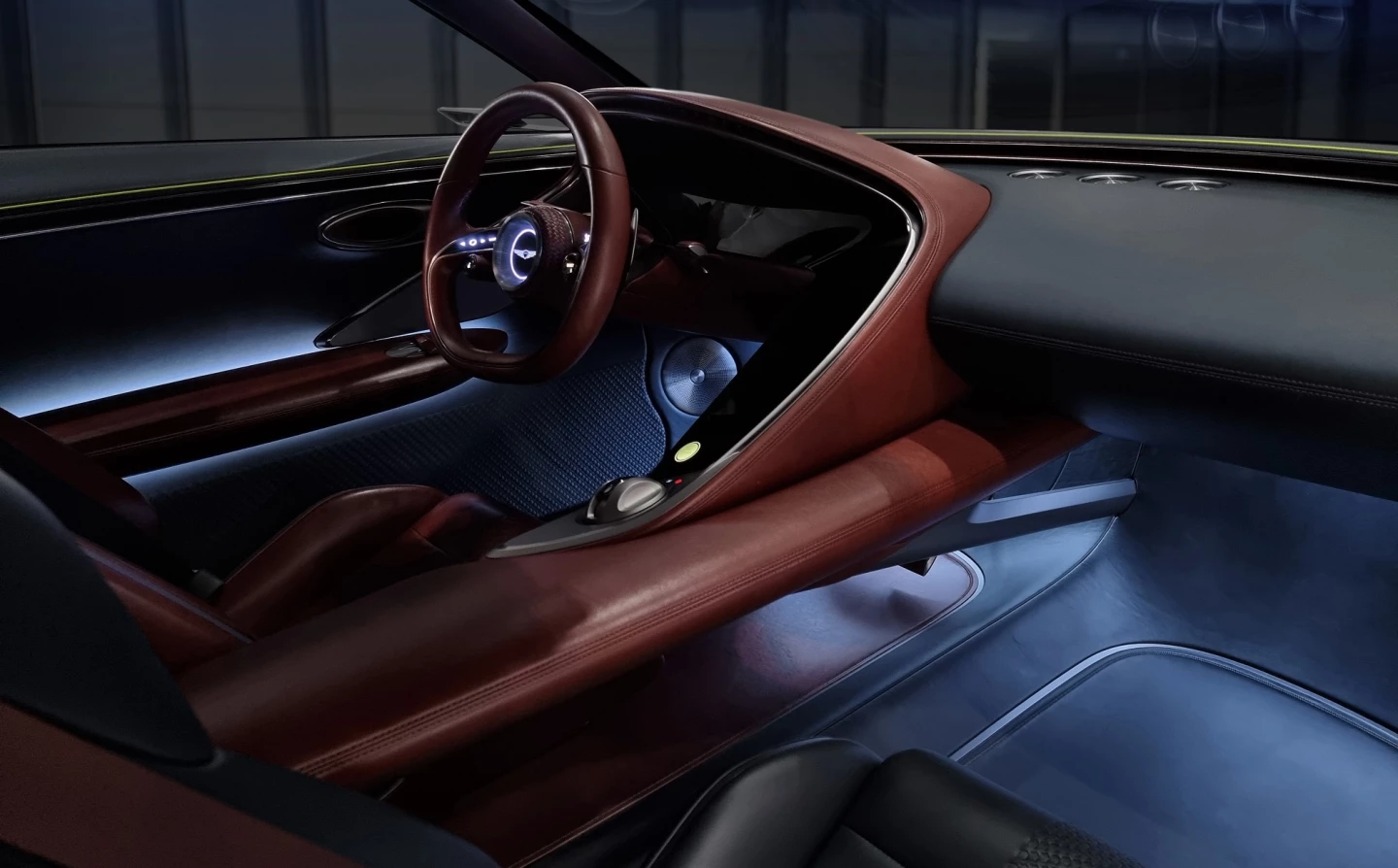 Scotch brown leather wraps the driver and separates them from the rest of the vehicle