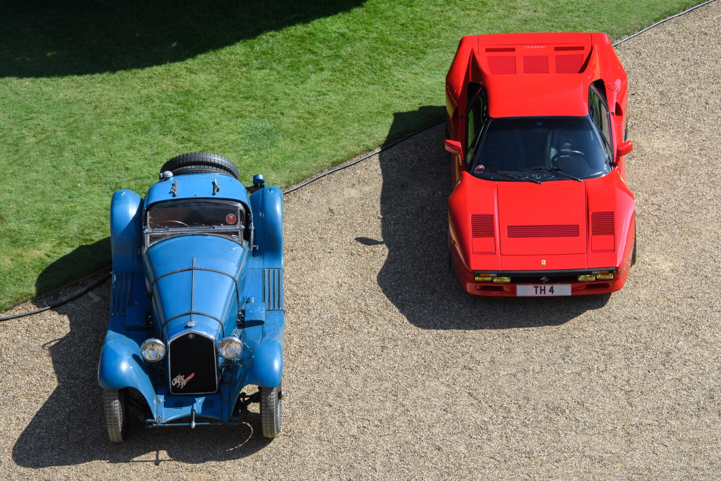 Two classics half a century apart in age. At left is Alfa Romeo 8C 2300 Short Chassis Spider with coachwork by Giuseppe Figoni. At right is one of the six Ferrari 288 GTO prototypes built in 1983.