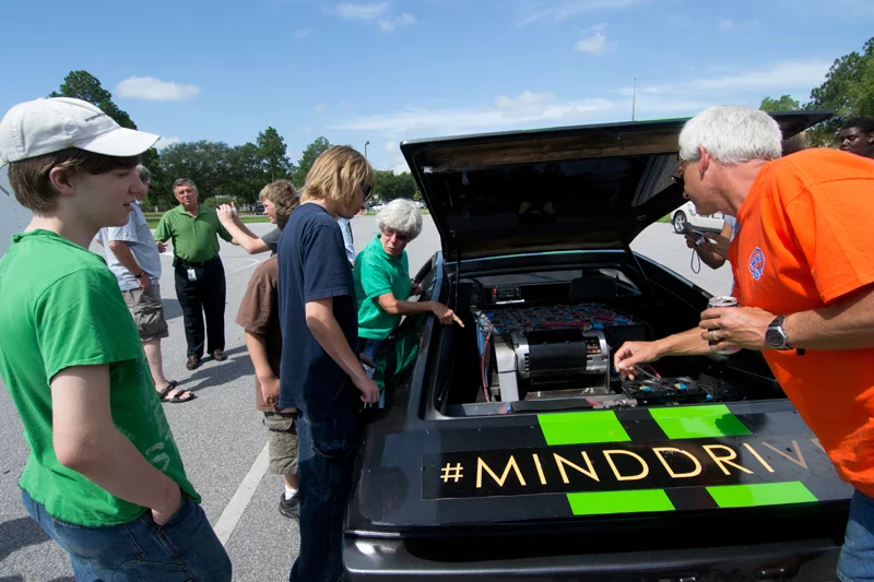 Students and mentors take time out to talk to the locals and the media about the vehicle and the organization that helped them build it
