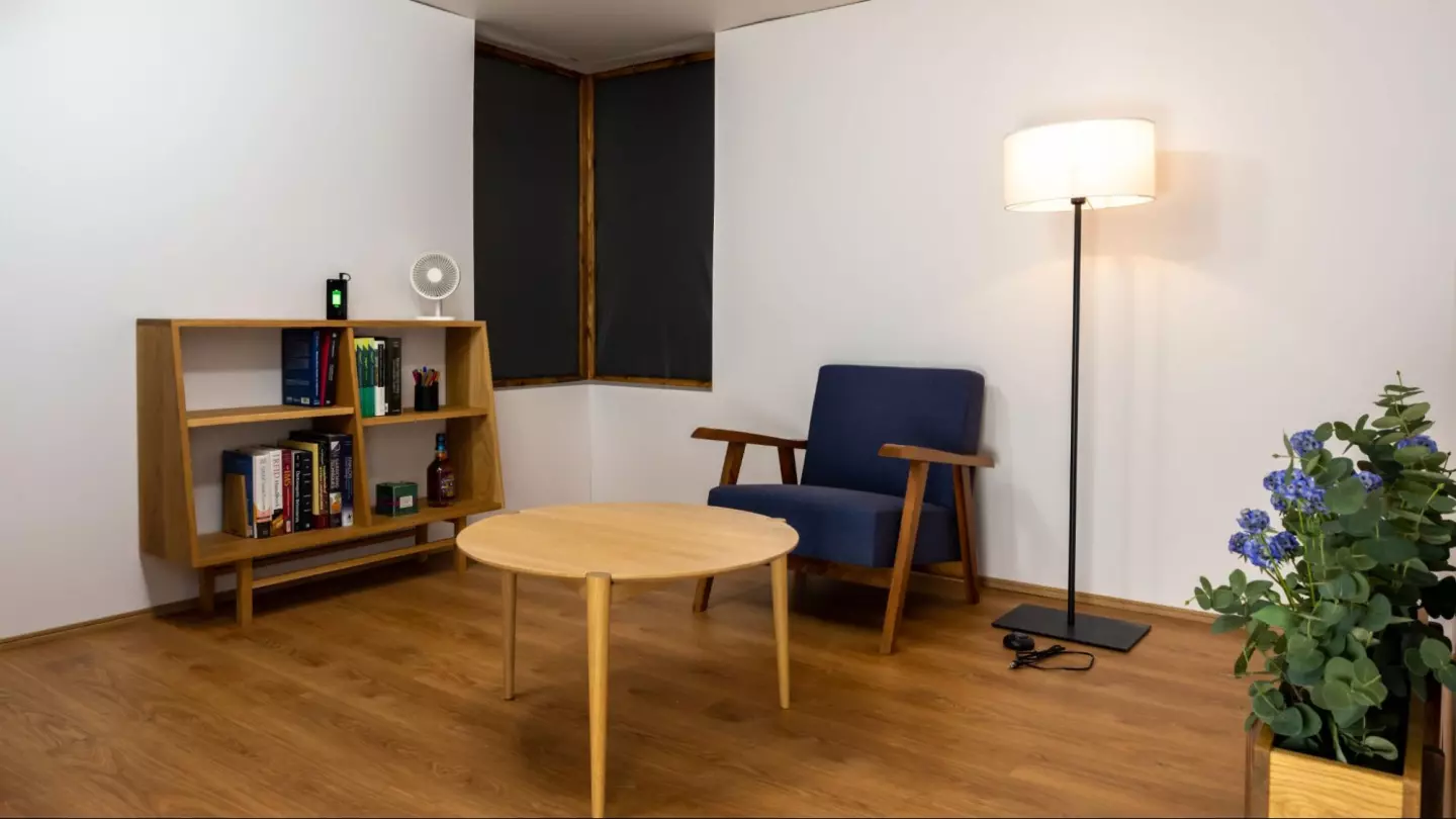 A more real-world version of the wireless charging room, with the system feeding energy wirelessly to the lamp,